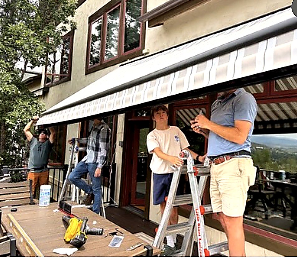 The Ben’s Blinds crew installing a retractable awning on a Steamboat Springs deck